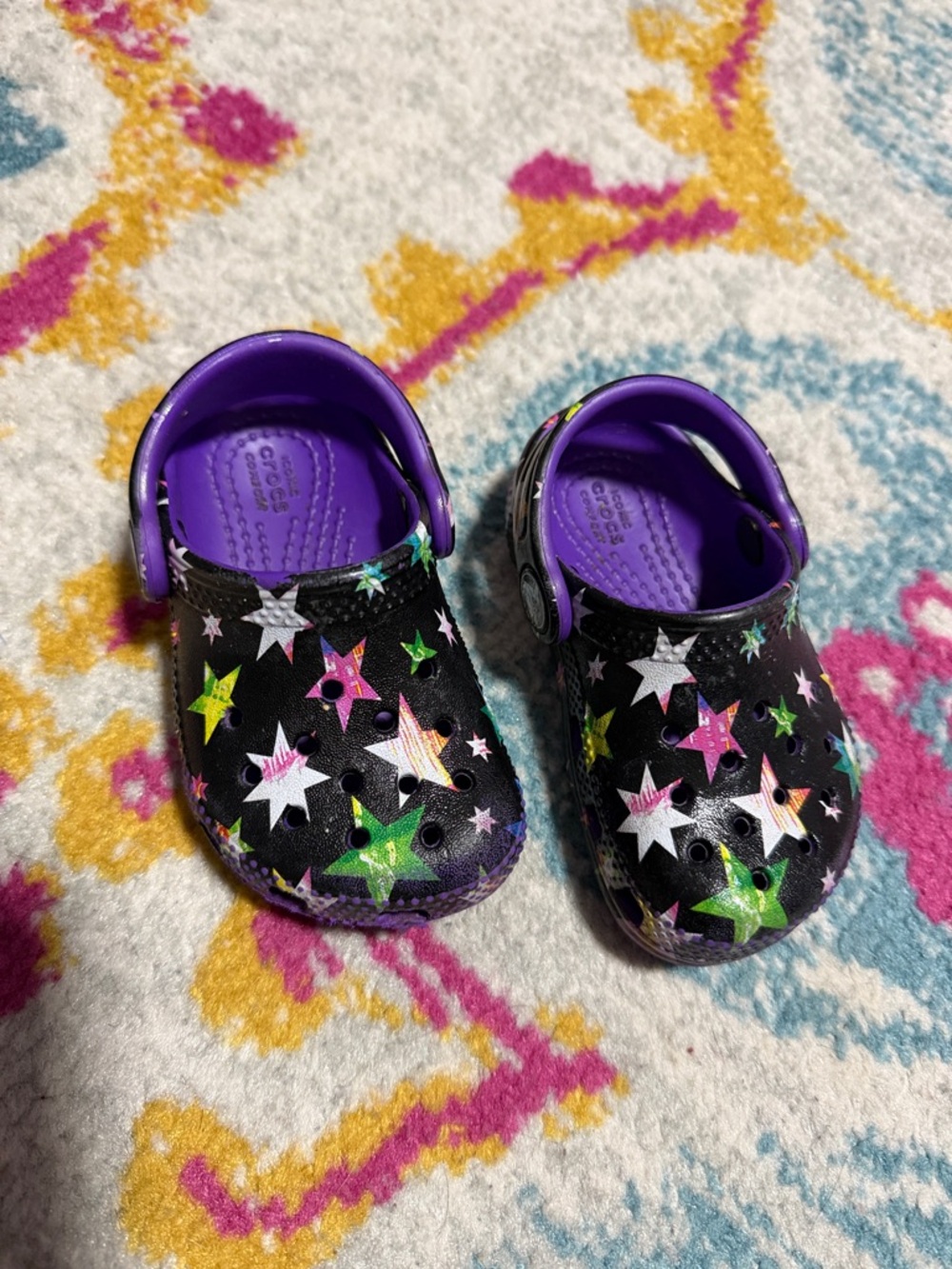 CROCS Kids Black Star-Print Clogs with Purple Interior